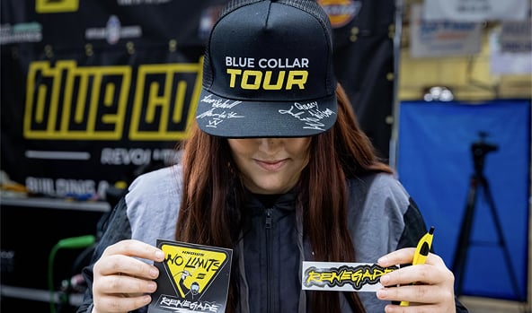 Student holding stickers